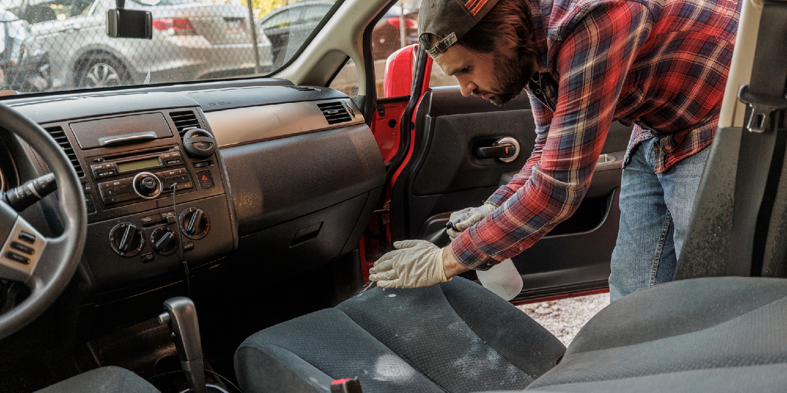 Professional cleaner is preparing seats for deep washing