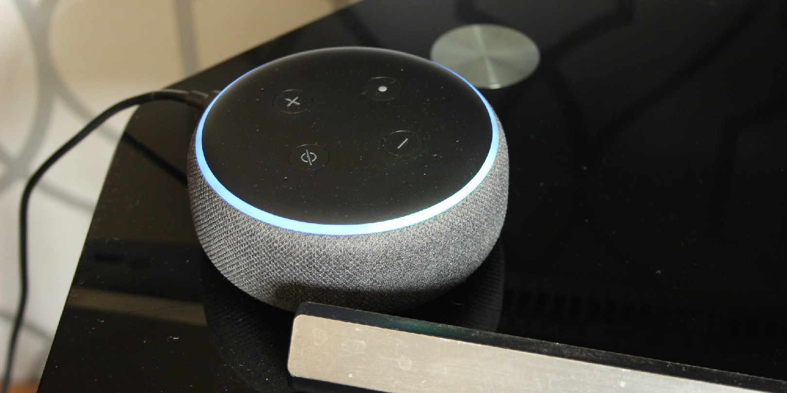 Amazon Alexa speaker bluetooth virtual assistant on a tv stand