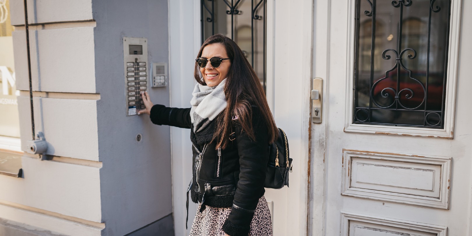 arlo-vs-ring-doorbell the-independence A woman talking on the intercom