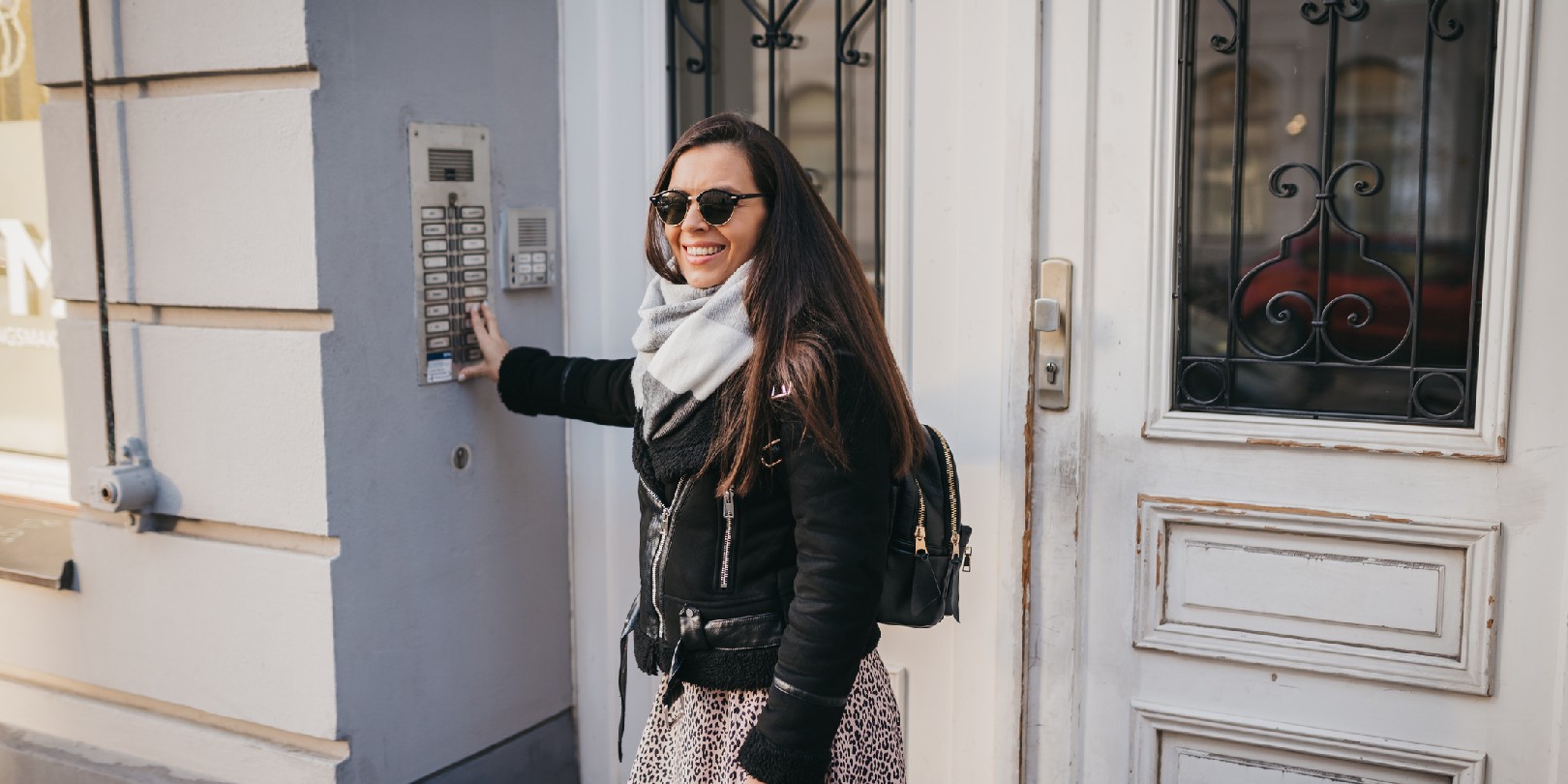 A woman talking on the intercom