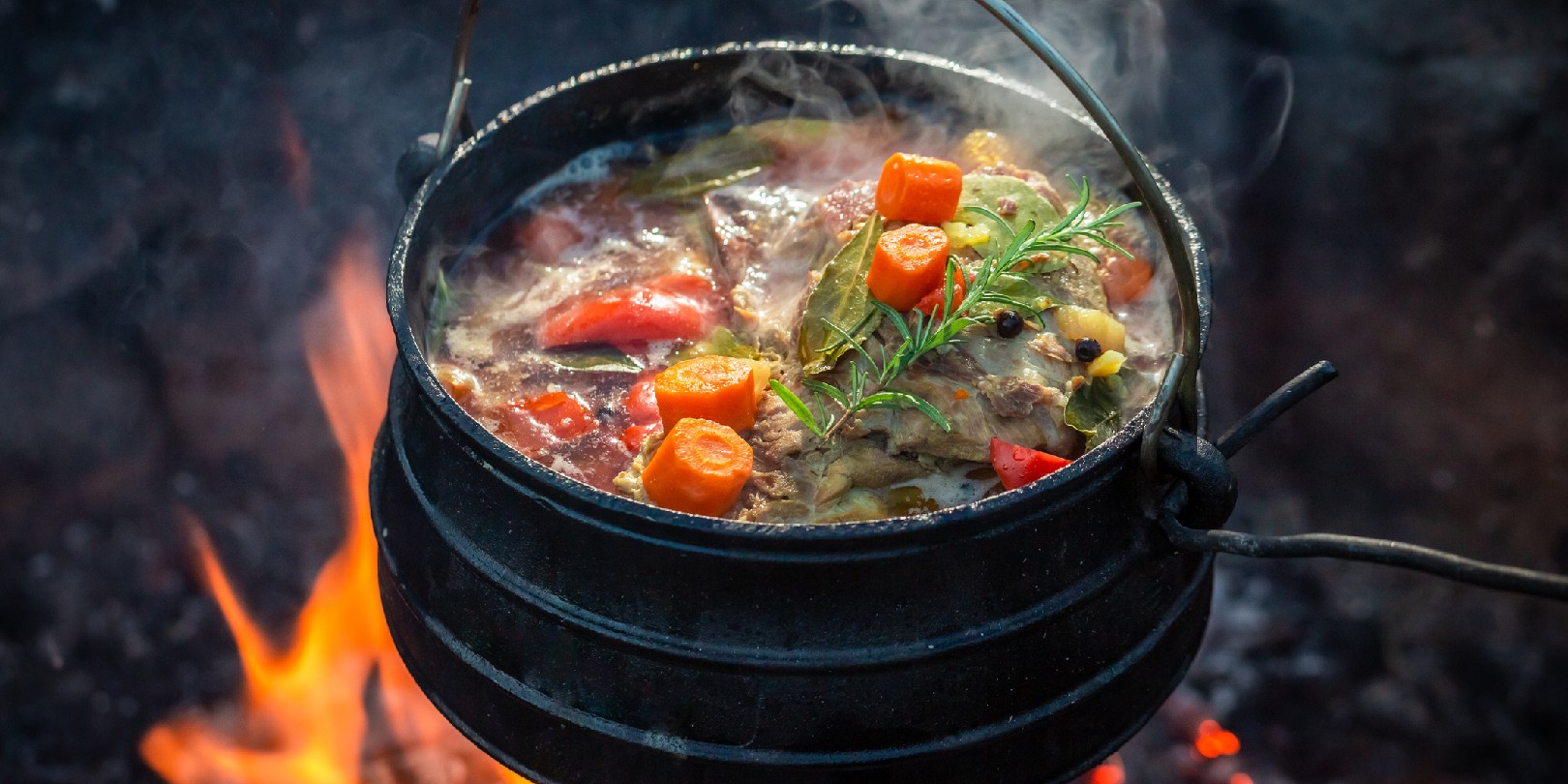 campfire-cooking the-independence Tasty and spicy hunter's stew on bonfire