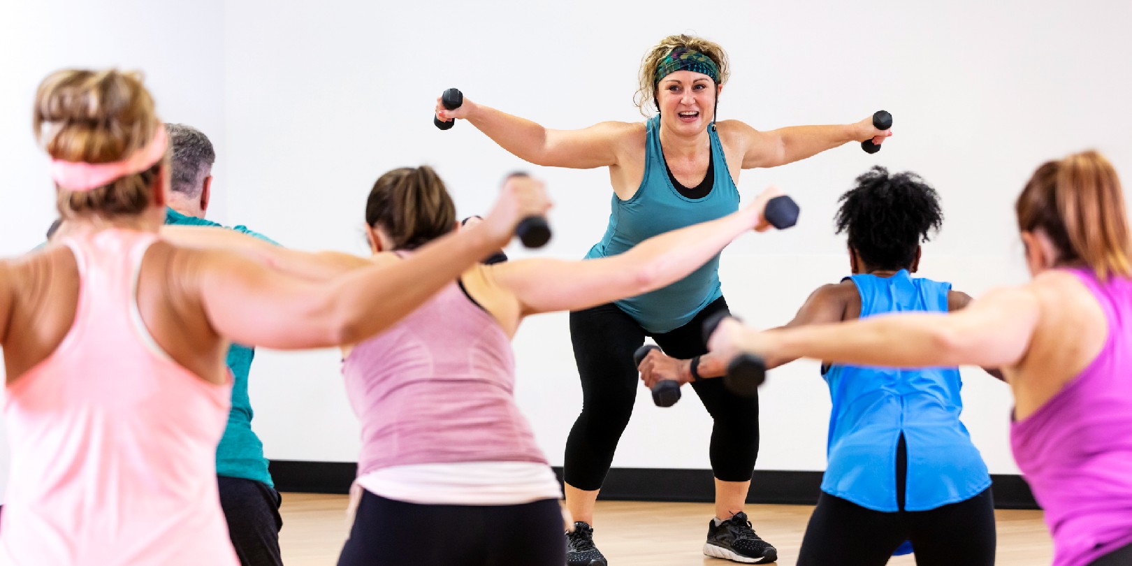 cardio-before-or-after-weights the-independence Hispanic woman leading aerobics class