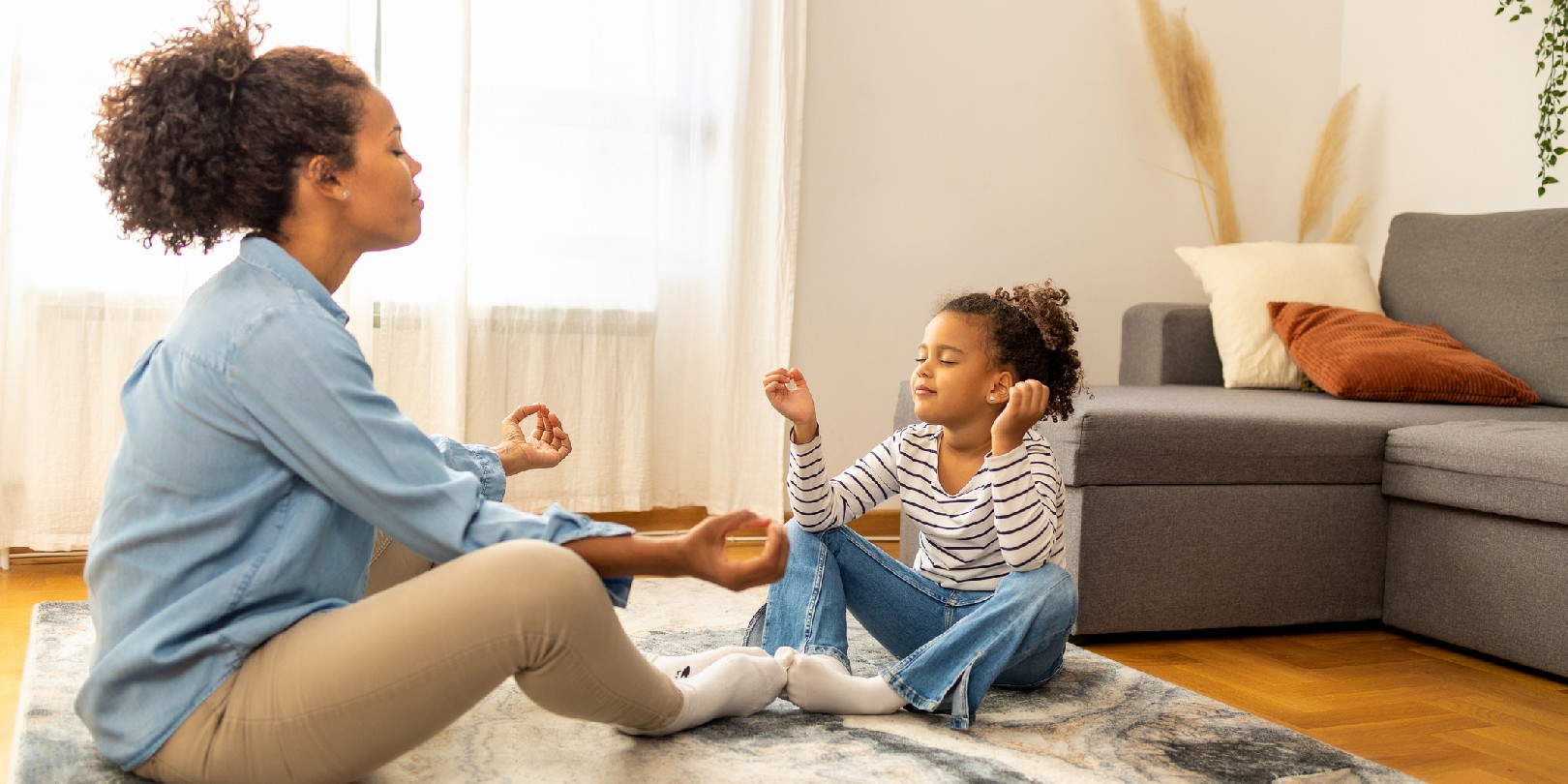 mindfulness-for-kids the-independence Mother and daughter practice meditation in the living room