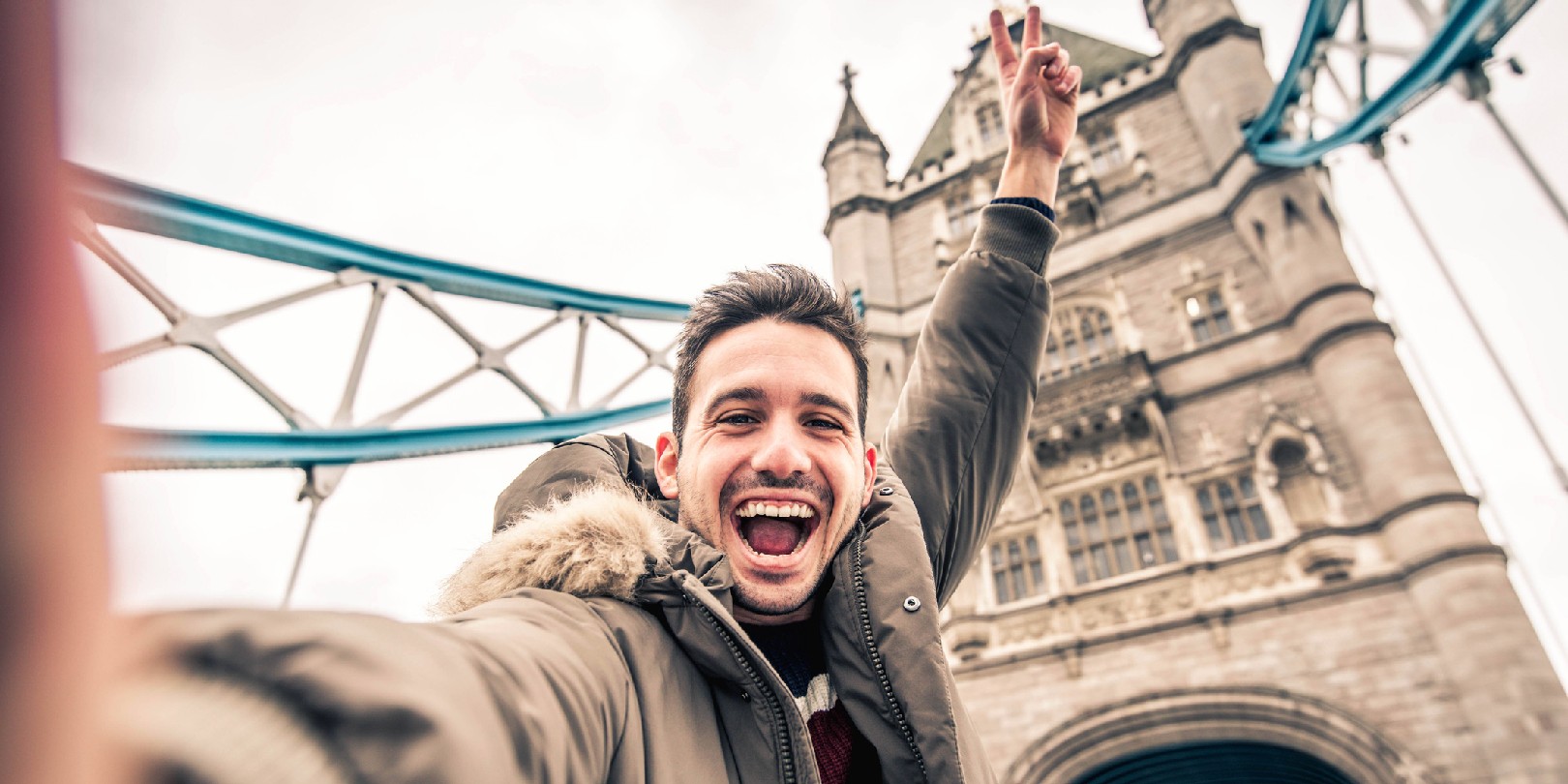 outdoor-activities-in-london the-independence Smiling man taking selfie portrait during travel in London, England