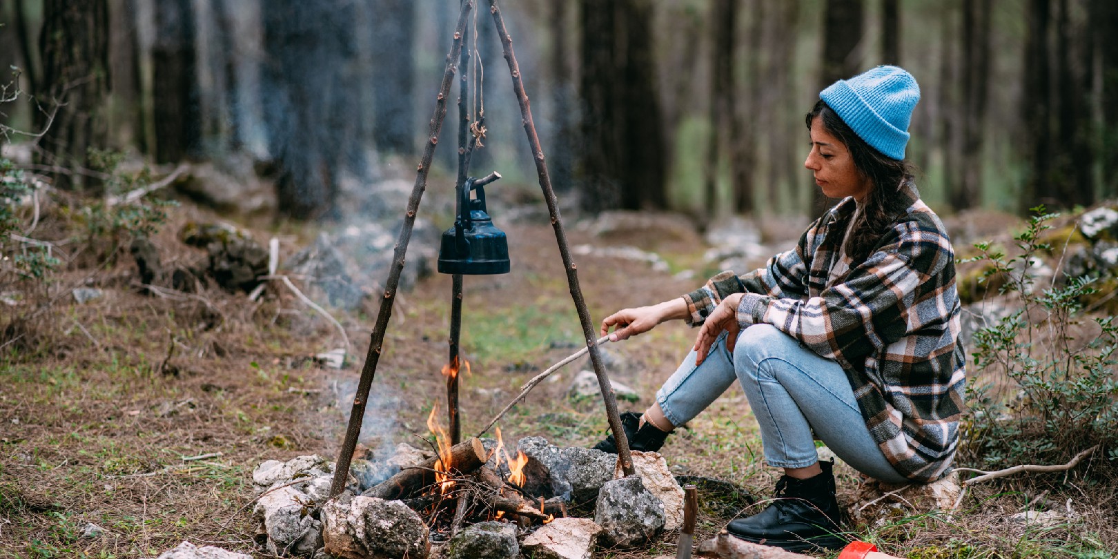 starting-a-fire-with-sticks the-independence Beautiful Woman by the Campfire