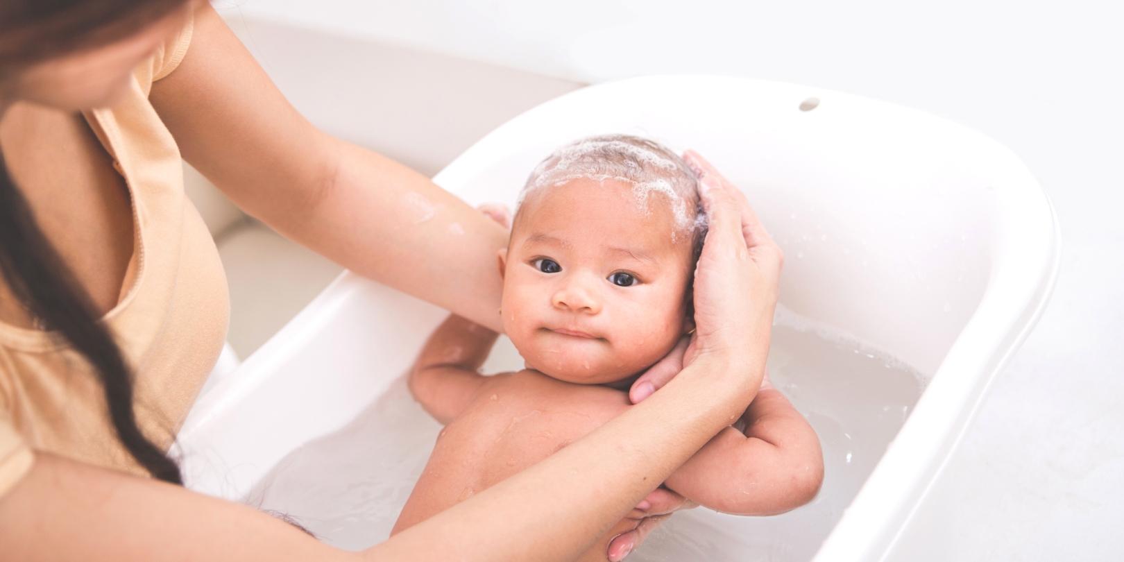 bathing-a-newborn the-independence Baby Is Being Bathed