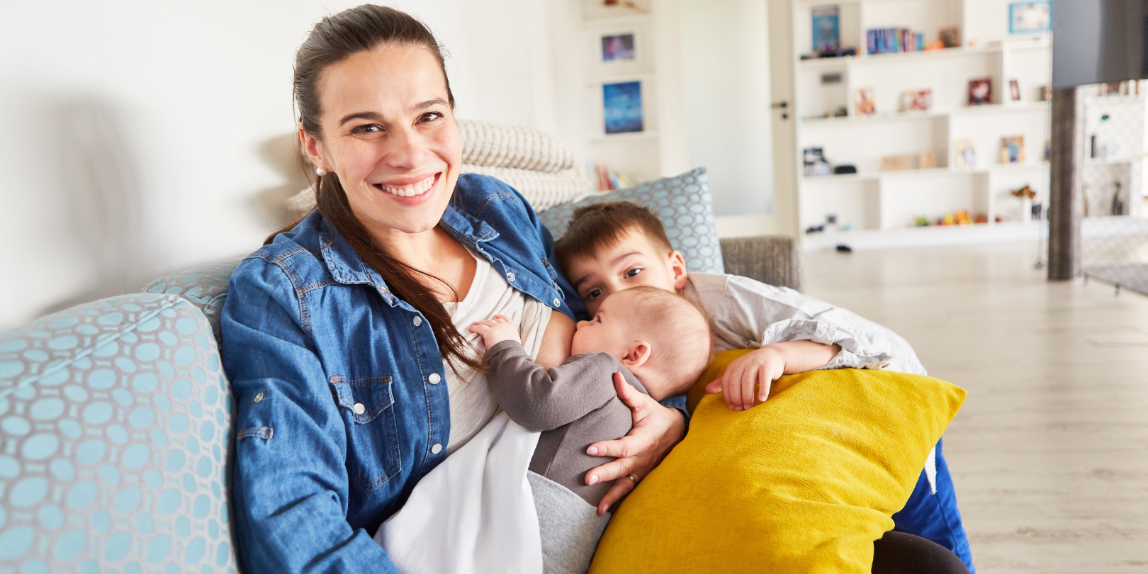 Happy Smiling Mother Breastfeeding Baby