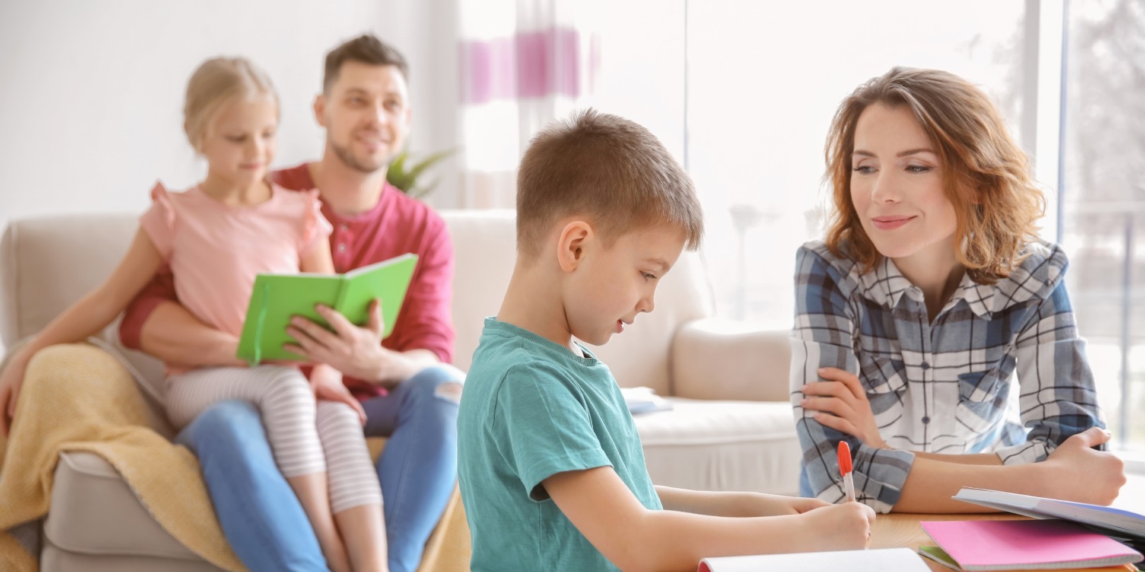 Mother helping daughter with homework