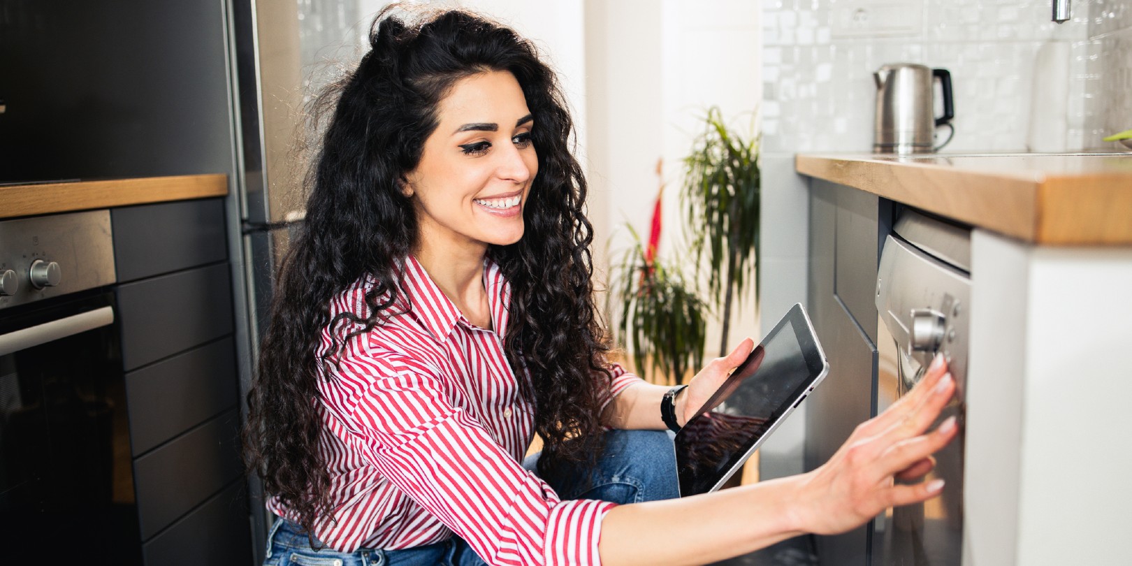Young woman using smart home technology