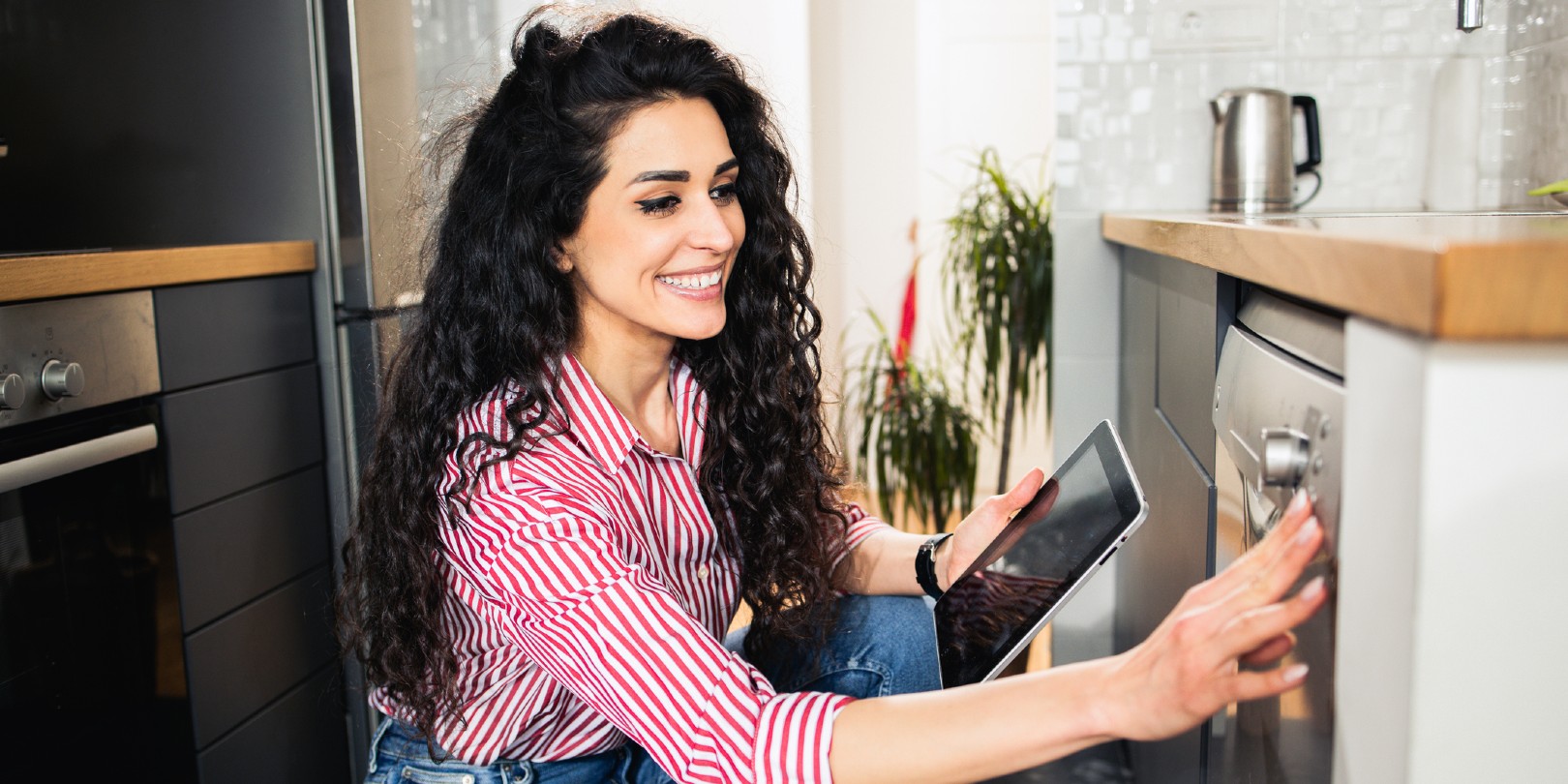 home-automation the-independence Young woman using smart home technology