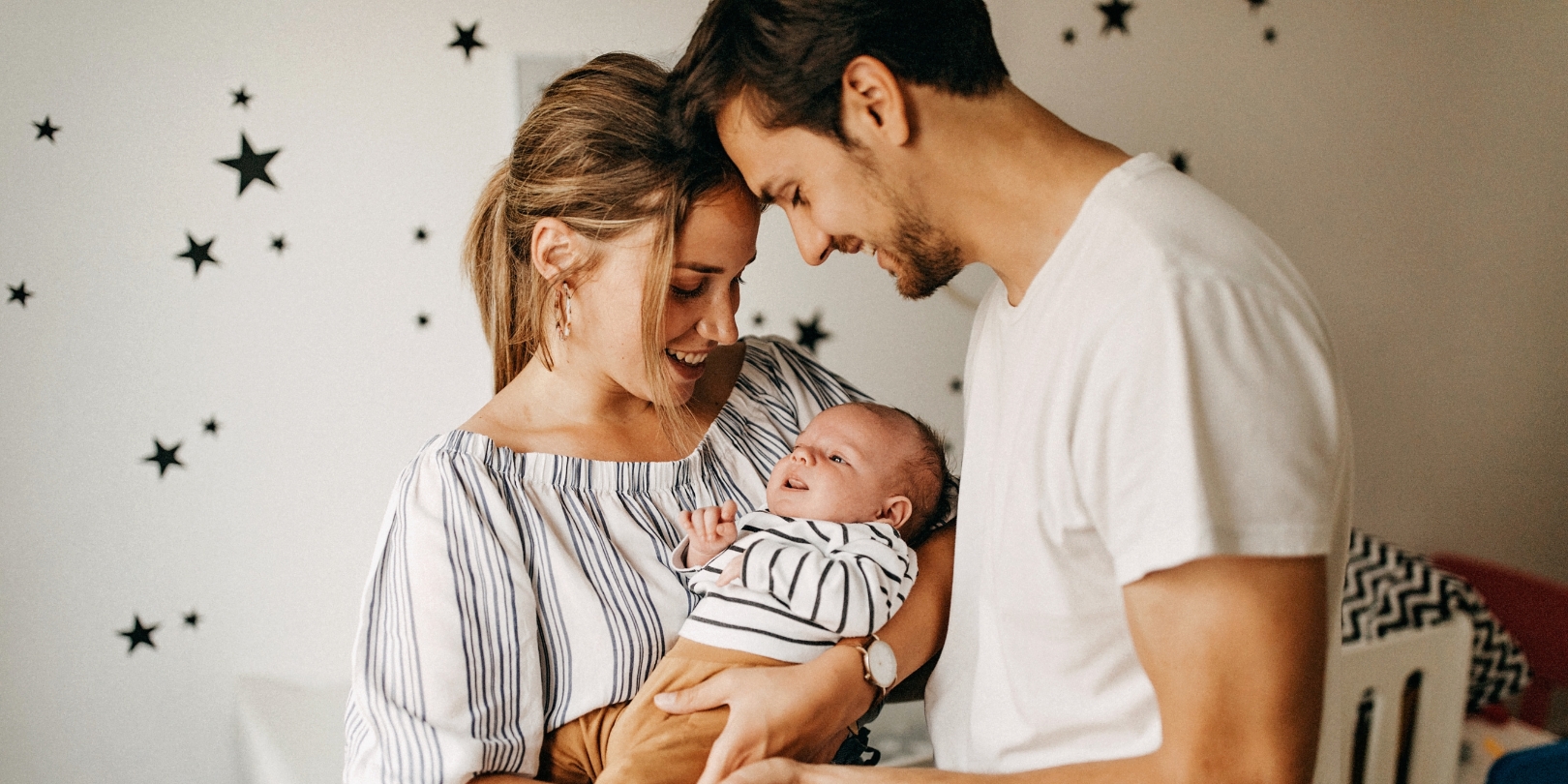 Parents holding their baby